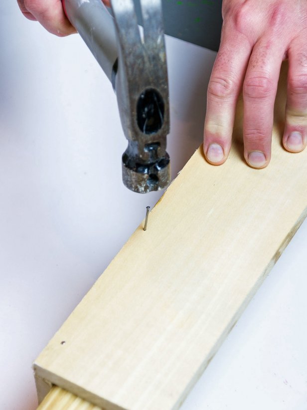 Add a bead of wood glue to the narrow edge of one of the boards. Press it against the flat side of the other board making an ‘L’ shape. Secure with at least 5 finishing nails through the flat side and into the narrow edge. Sink nail heads slightly with a nail set. There is no need to fill these nail holes as this will be the back of the shelf.