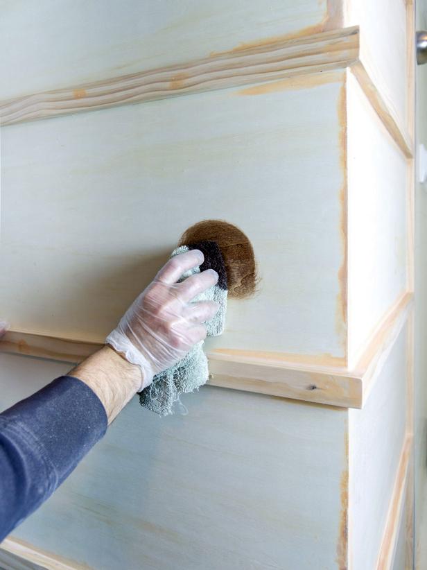 Remove the template. Sand the entire project except the word or phrase. Mask off the walls, ceiling and floor around the project with painter’s tape. Add stain in as many coats as necessary to obtain desired color, sanding lightly between each coat with fine grit sandpaper.