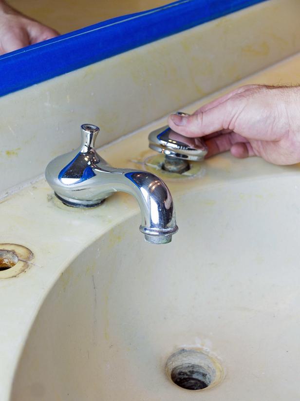 Remove the faucet, knobs and drain from the basin.