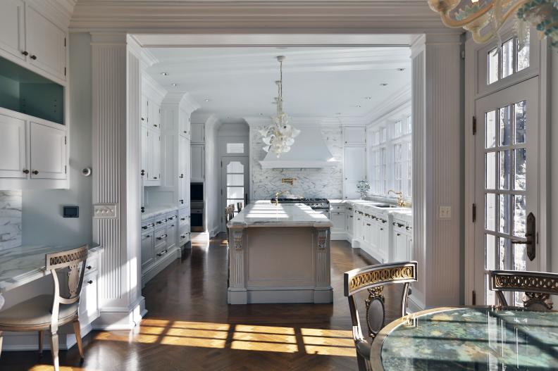 Traditional White Kitchen With Long Island and Wood Floors