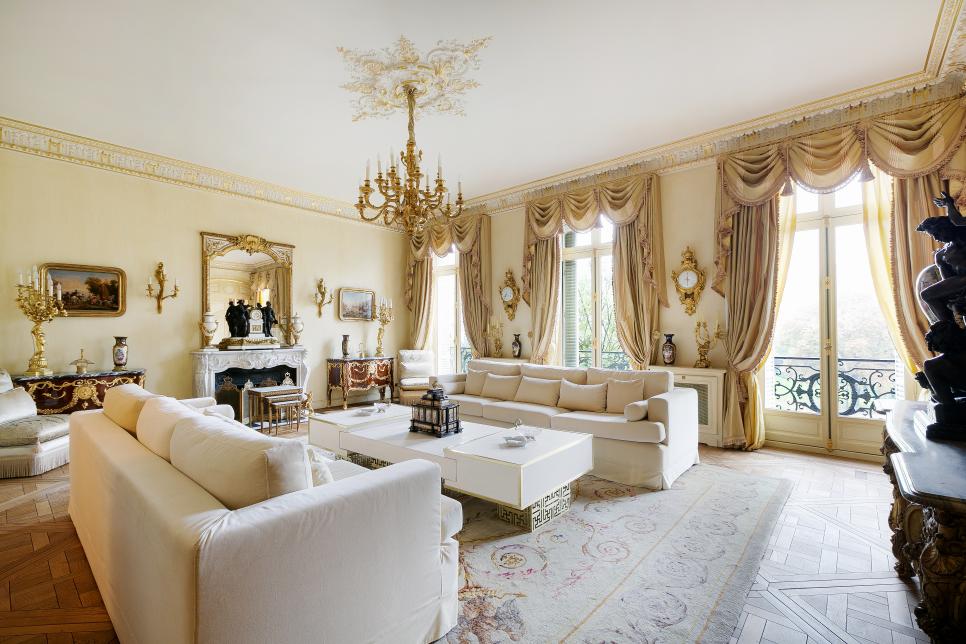 Lavish Victorian Living Room In Paris With White Furniture Heavy Drapery And Gold Decorative Details Hgtv