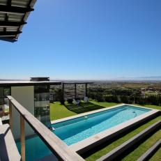 Balcony Look at Modern Swimming Pool and Vast Scenic View 