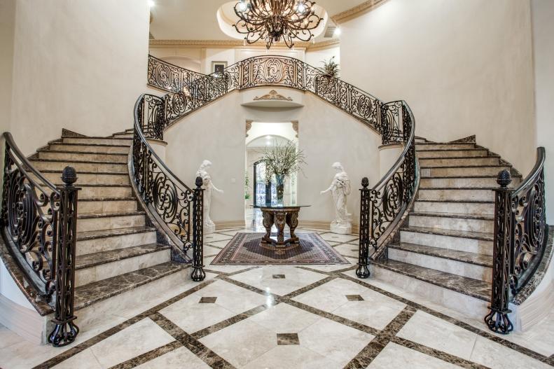 Mediterranean Two-Story Foyer With Marble Floors and Double Staircase