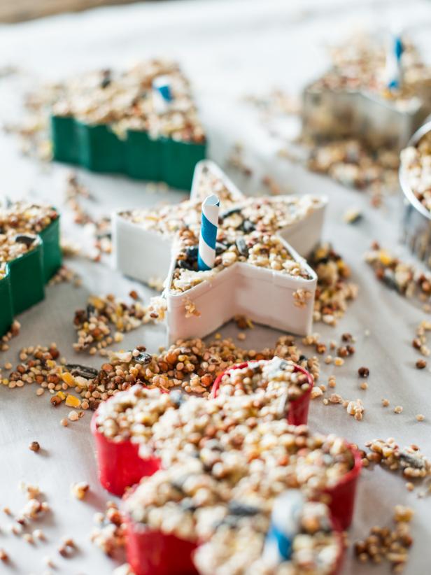 Allow birdseed ornaments to dry uncovered, at room temperature until hardened (several hours or overnight.) Gently push out of molds/cookie cutters and remove straws.