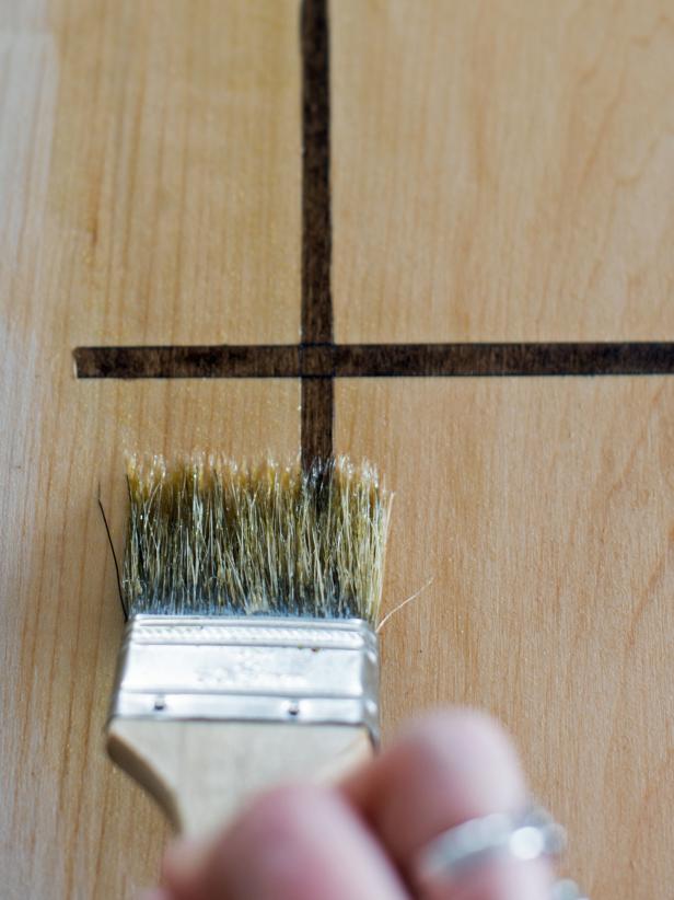 Allow stain to fully dry before moving to this step. With 2-3&quot; chip brush, apply a wood oil to seal and bring out the warmth of the wood. Apply to both sides of the game pieces and board. Wipe away excess oil with a lint-free cloth. Allow oil to dry fully before wrapping or playing.