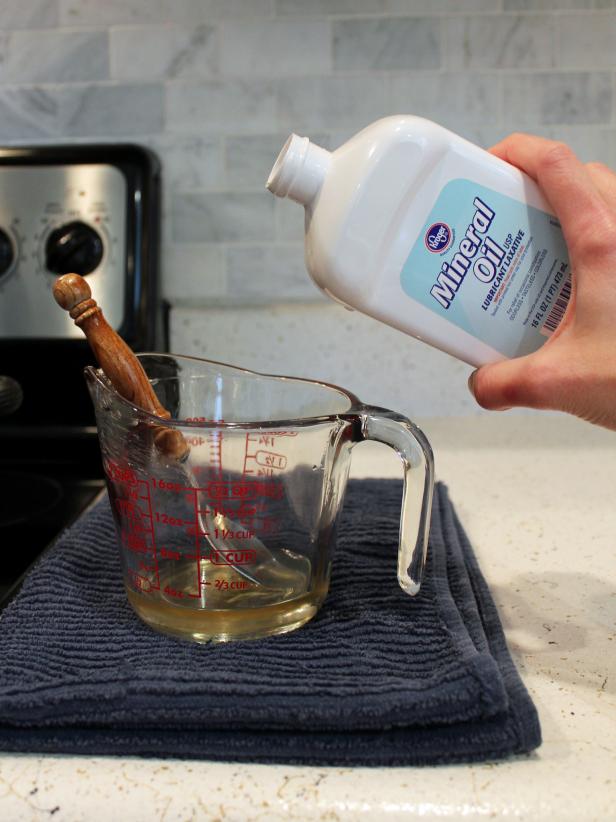 Use a glass measuring cup to determine the proper amount of mineral oil.