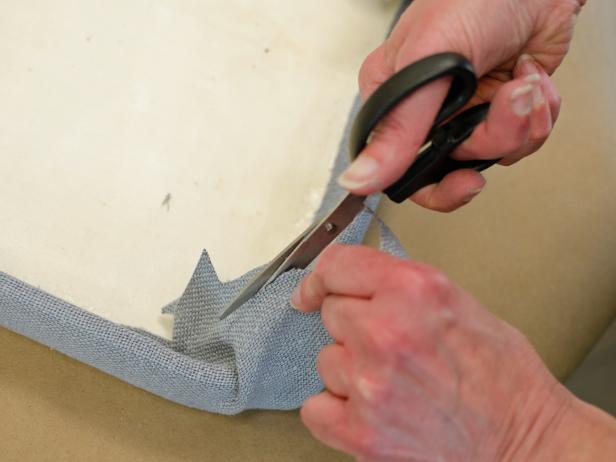Cut fabric at an angle on the tray's inside corner to eliminate excess fabric.