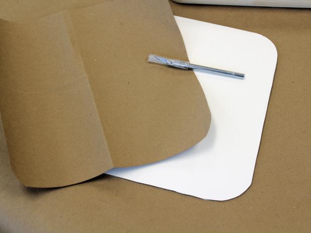 Using Kraft paper and foamcore to create templates for fabric-covered tray.