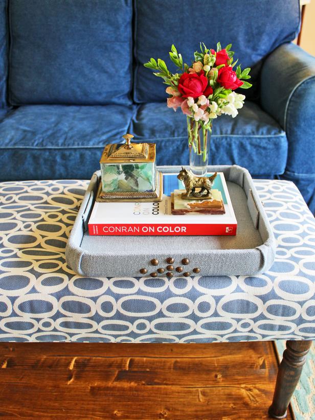 Covering a plain or dated tray with fabric is an easy way to tie it in with your decor. Your trendy new tray can then be used to corral coffee table necessities or as a cocktail tray when entertaining.