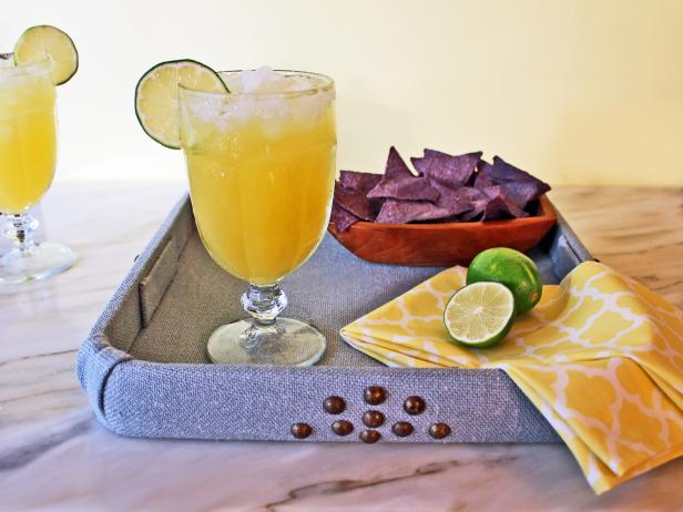 Mix up this classic lime margarita with a tropical twist to enjoy a summery sip any time of the year.