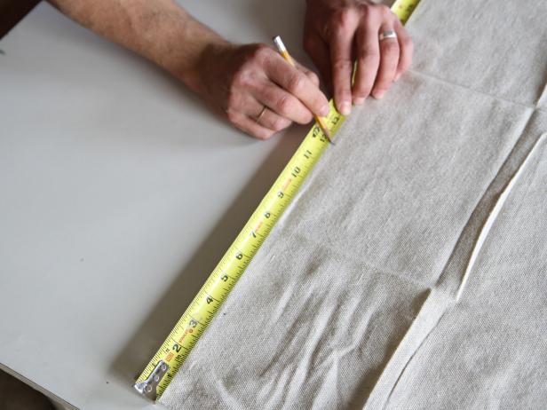Measure the width of the table runner on a drop cloth at 12&quot;.