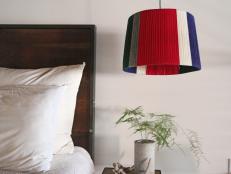 colorful yarn lampshade hanging in bedroom