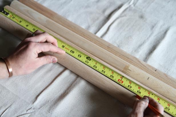 Measure and mark oak closet poles to make a coat rack.