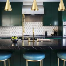 Green and White Eclectic Kitchen With Brass Pendants