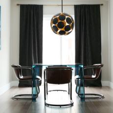 Black and White Contemporary Dining Room With Glass Table
