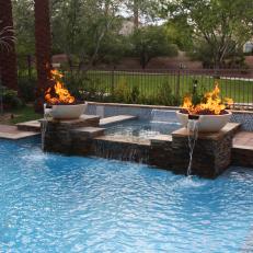 Swimming Pool With Flame-Topped Fountains
