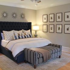 Tufted Navy Headboard and Contemporary Accessories in Master Bedroom