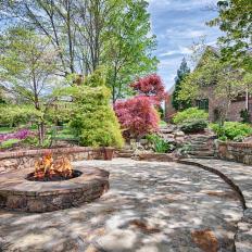 Stone Stairs Lead To Stunning Backyard Fire Pit With Ample Room For Entertaining 