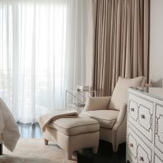 Transitional Bedroom Sitting Area Boasts Plush Armchair