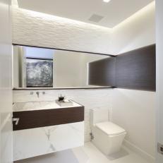 Chic, Elegant Powder Room Features Floating Marble Vanity & Glass Mosaic Tile