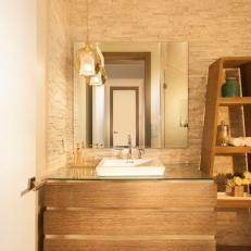 Contemporary Powder Room Features Warm Stone Mosaic Walls