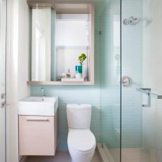 Sleek Contemporary Bathroom Features Light Blue Subway Tile Wall