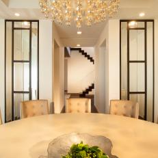 Bright, Contemporary Dining Room With Pendant Chandelier