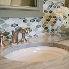 Colorful Backsplash Brightens An Updated Traditional Bathroom With Vanity & Marble Countertop