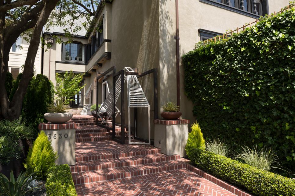 Brick Walkway Framed by Drought-Tolerant Plants and Boxwoods