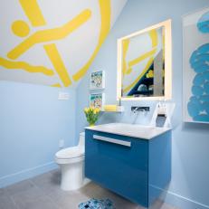 Boy's Bathroom Invokes Swimming Pool Theme With Blue Vanity and Mosaic Tile