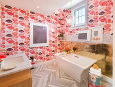 Bathroom With Lipstick Print Wallpaper, Brass Accents & Cast Iron Tub