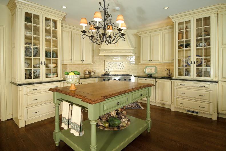 Neutral Traditional Kitchen With Cream Cabinets & Green Island