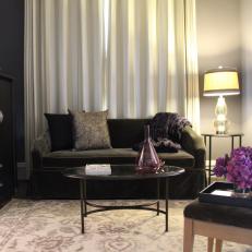 Transitional Living Room Boasts Black Sofa & Purple Accents