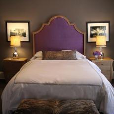 Transitional Bedroom Features Bold Purple Headboard