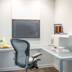 Sleek Home Office Features Contemporary Art & Floating Shelf