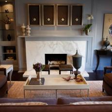 Elegant White Marble Mantel in Transitional Living Room 