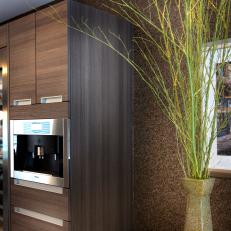 Modern Kitchen Cabinets With Textured Wall & Tall Stone Vase