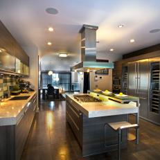 Modern Kitchen With Woodgrain Cabinetry & Stainless Steel Appliances