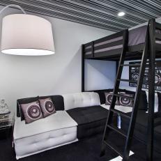 Loft Bed Over Black and White Sectional With Music Themed Decor