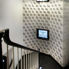 Staircase With Carpeted Steps and Patterned Accent Wall