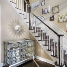 Foyer With Mirrored Dresser and Family Photo Gallery Wall