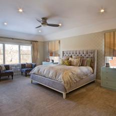 Serene, Neutral Tones in Transitional Bedroom With Tufted Furniture Details, Pale Turquoise Dresser and Seating Area 