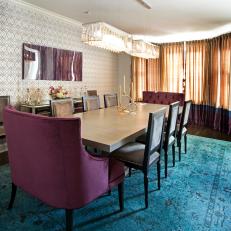 Dining Room With Bold Turquoise Rug & Purple Tufted End Chairs