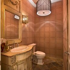Gorgeous Traditional Bathroom With Distressed Vintage Vanity, Patterned Wallpaper and Marble Tile Flooring 