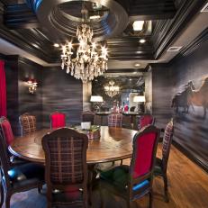 Dark Dining Room With Blurred Wall Look, Decorative Black Molding Ceiling and Large Circular Dining Table 