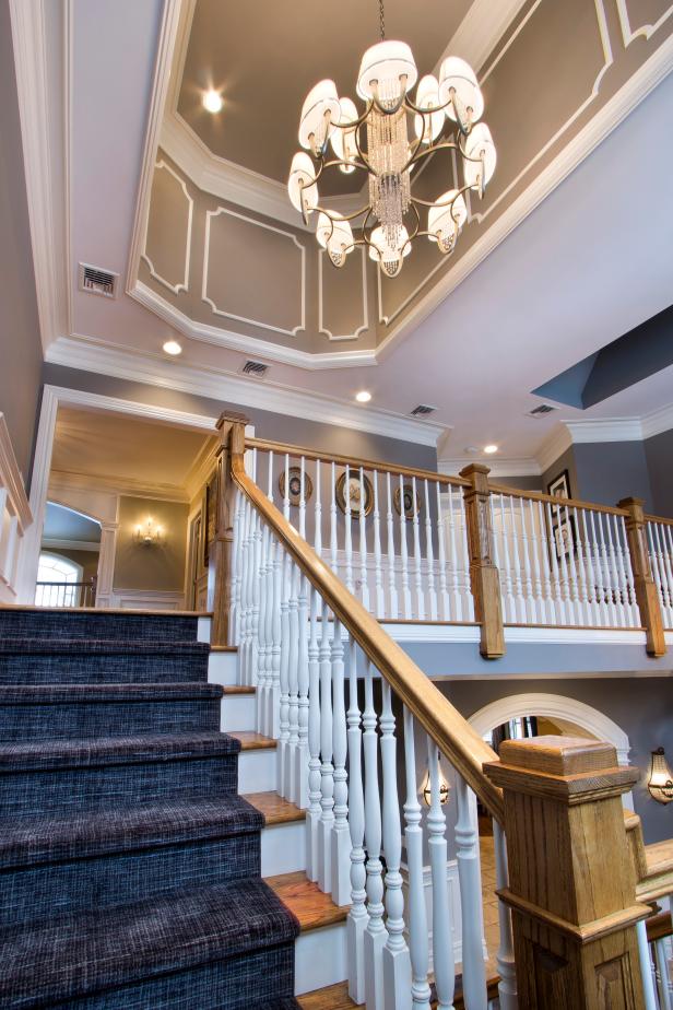 Mid Stair View Of Deep Tray Ceiling With White Frame Design Over