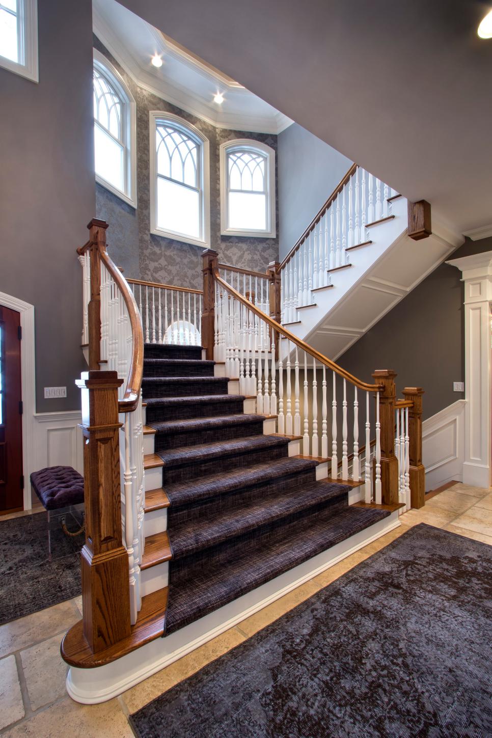 Foyer Stairs With Purple, Gray and Black Stair Runner, Wood Columns and