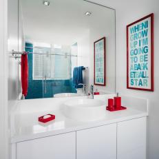 White Bathroom With Red and Blue Accents