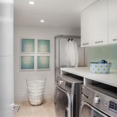 Green and White Laundry Room With Tile Backsplash