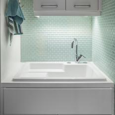 White Sink With Green Glass Tile Backsplash